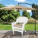 White Wicker Chair With Tan Cushion