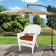 White Wicker Chair With Brick Red Cushion