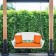 White Resin Wicker Porch Swing with Orange Cushion